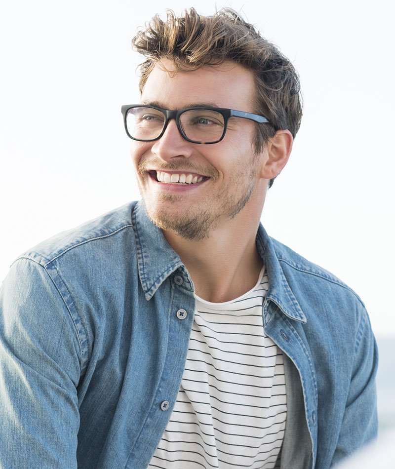 man with glasses smiling