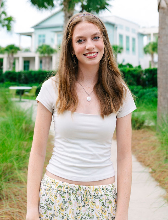 girl wearing retainer after treatment