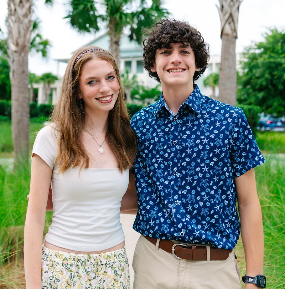 two teens smiling